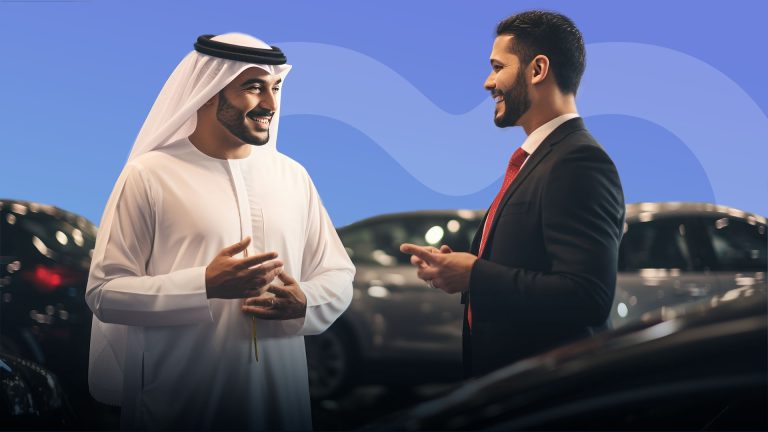 Two men conversing in a car dealership in the Middle-East
