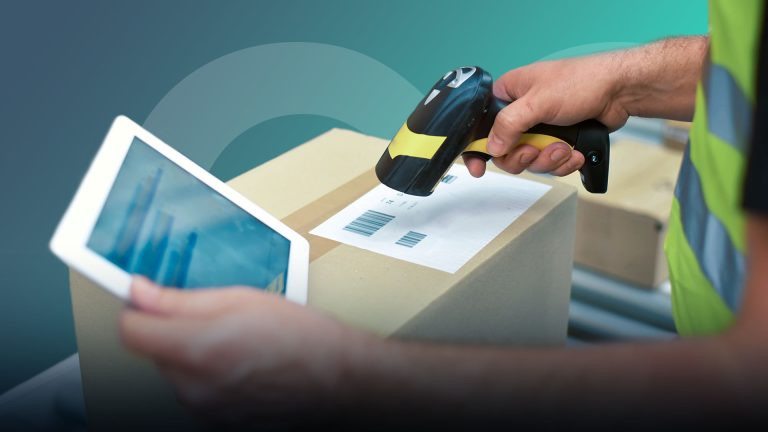 Man scanning barcodes next to tablet